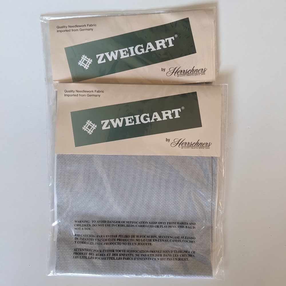 2 packages of grey Zweigart needlework fabric